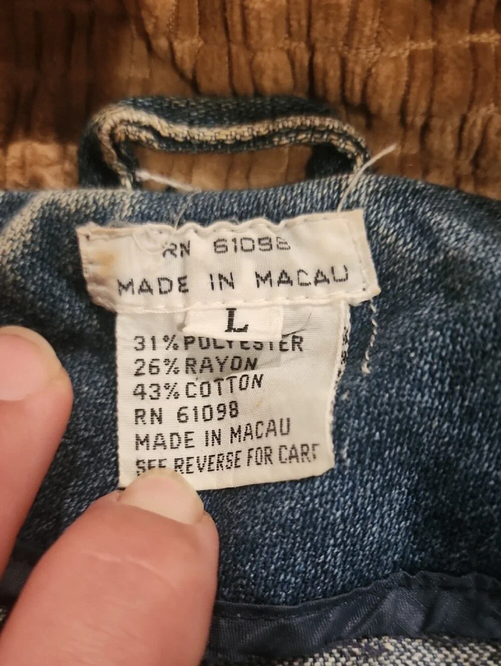 Vtg blue denim bomber jacket featuring a distinctive brown color